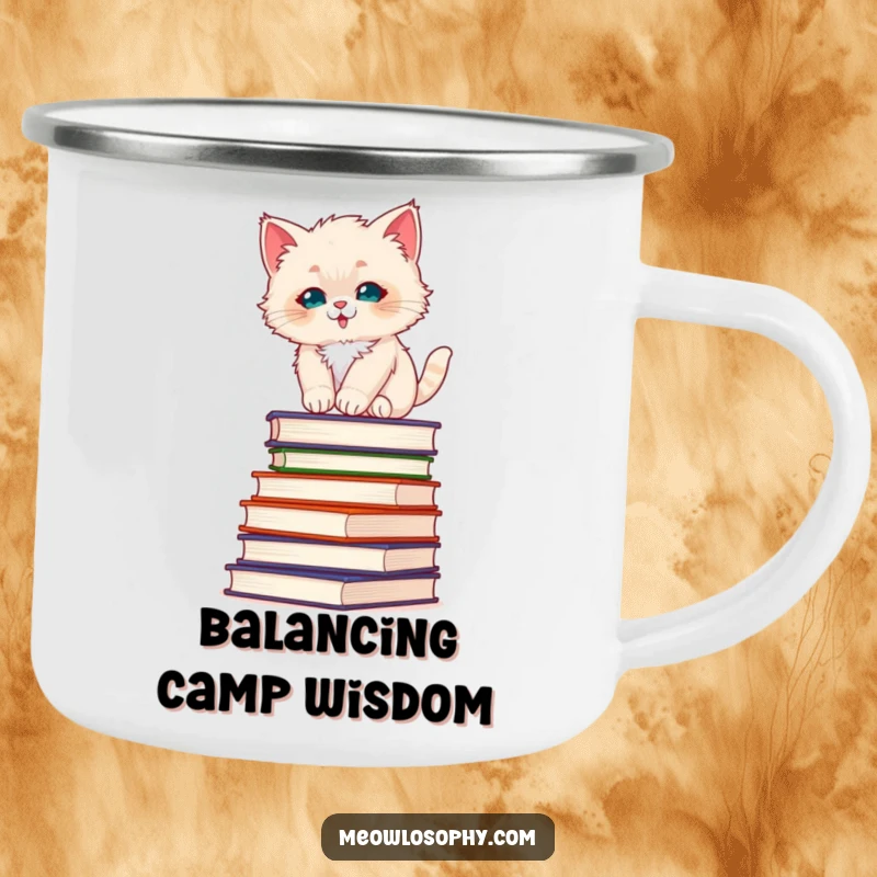 Funny fluffy kitten camping mug, showing a kitten balancing on philosophy books, ready for any adventure with a touch of wisdom.