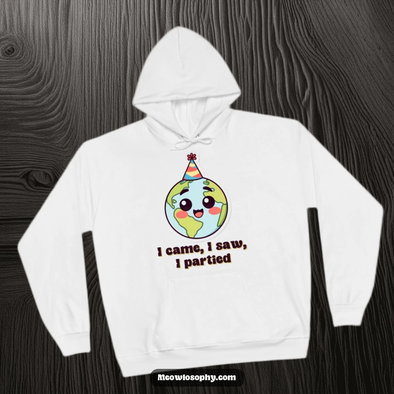 Funny hoodie with a stylized earth character wearing a party hat, looking happy and surprised, perfect for cozy, cheerful wear.