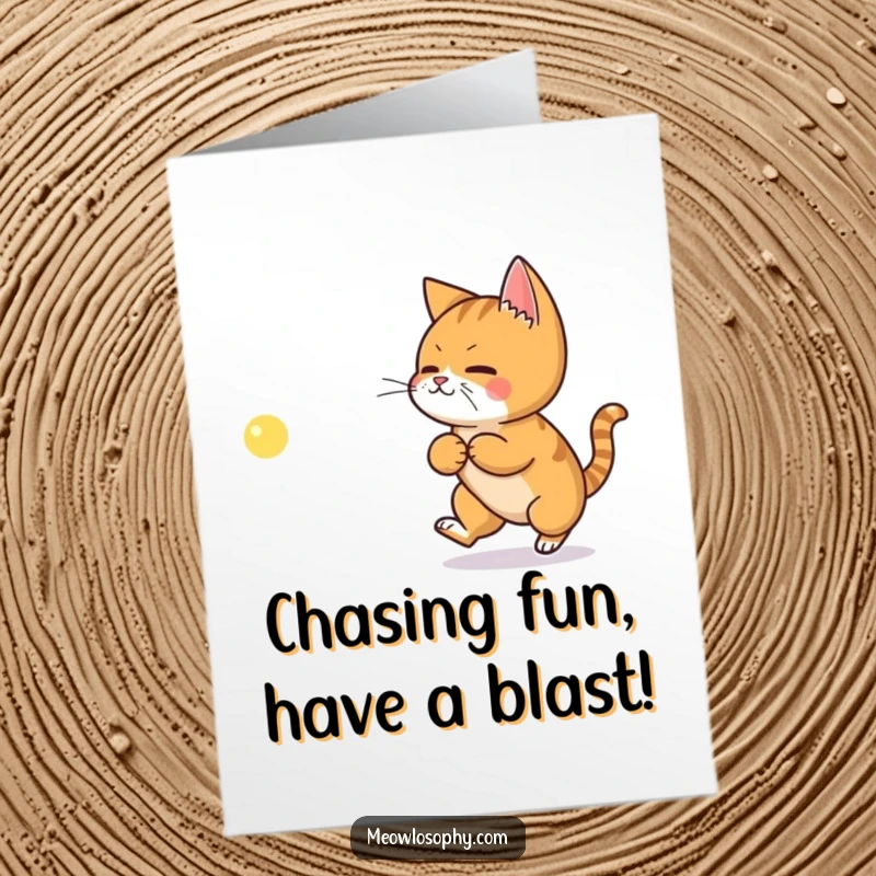 Funny Free Printable Birthday Card: Ginger cat intently chases a laser dot shaped like a philosophical symbol, pondering life's mysteries.
