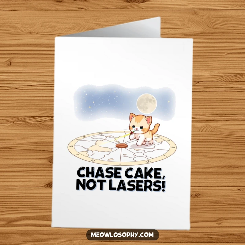 Funny Free Printable Birthday Card: A playful kitten zooms energetically across a celestial map, chasing a bright red laser pointer dot.