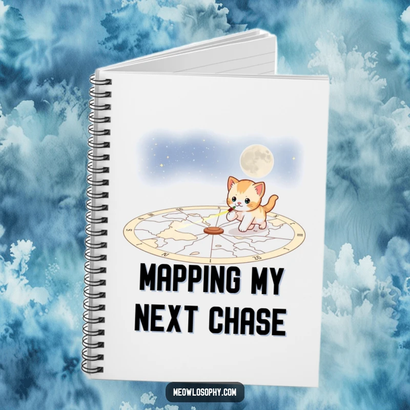 Funny playful kitten notebook, featuring a kitten chasing a laser pointer across a celestial map, ideal for notes and cosmic adventures.