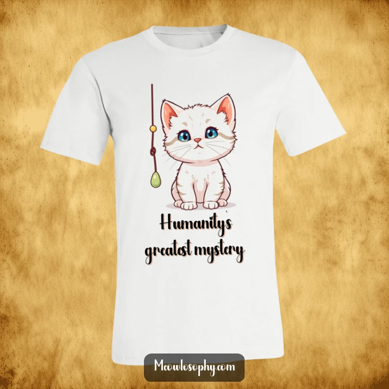 Funny curious kitten t-shirt, intensely focused on batting a dangling string, showcasing a thoughtful and playful feline personality.